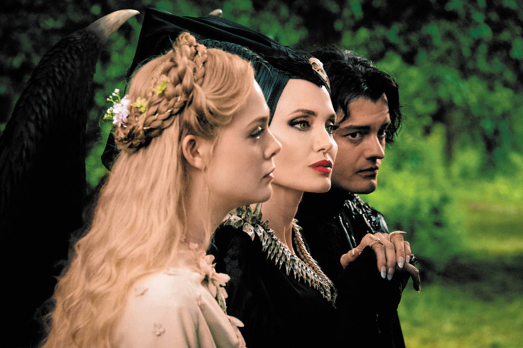 Elle Fanning is Aurora, Angelina Jolie is Maleficent and Sam Riley is Diaval in Disney’s live ...