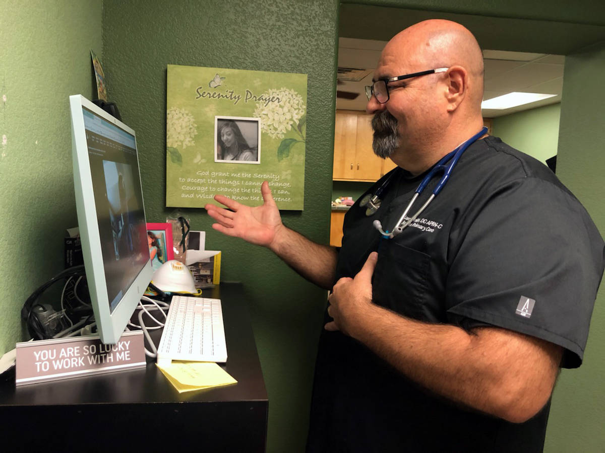 (Dr. Larry Smith) Dr. Larry Smith conducts a telehealth appointment with a patient at Boulder P ...