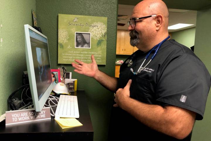 (Dr. Larry Smith) Dr. Larry Smith conducts a telehealth appointment with a patient at Boulder P ...