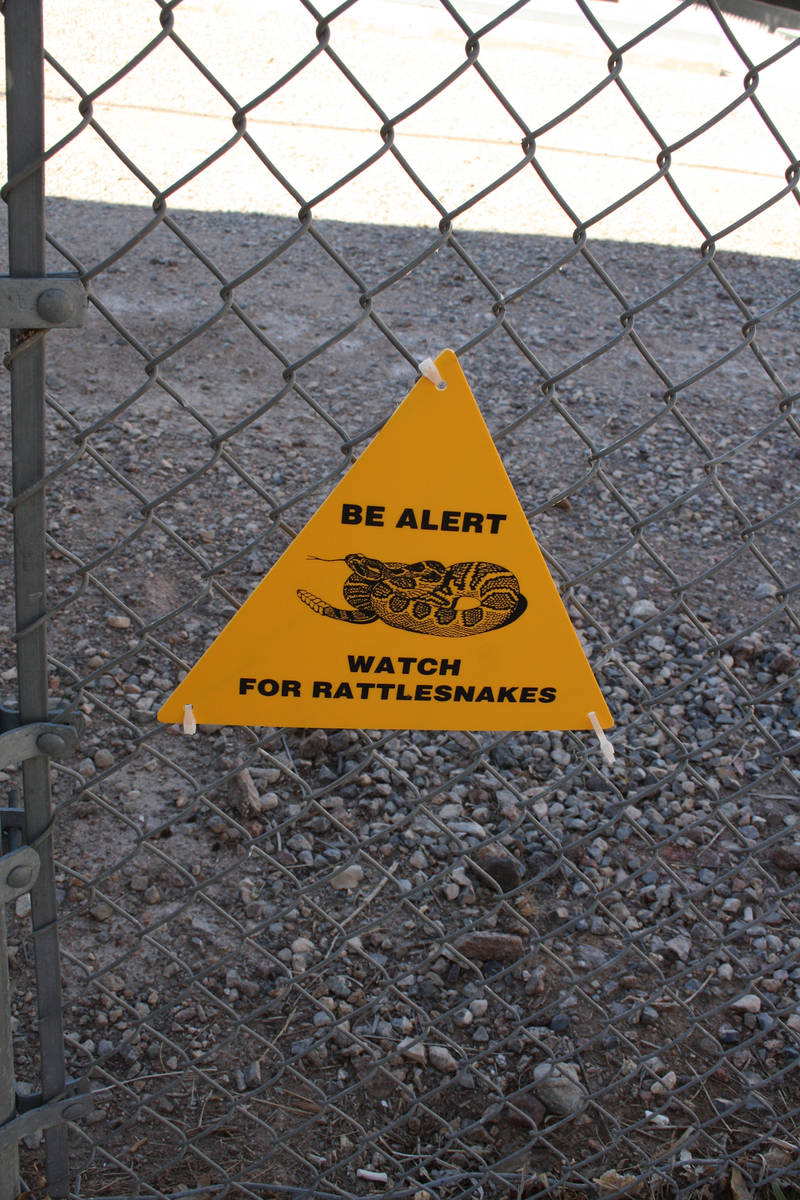 (Deborah Wall) Signs help remind outdoor enthusiasts to be on the look out for rattlesnakes, wh ...