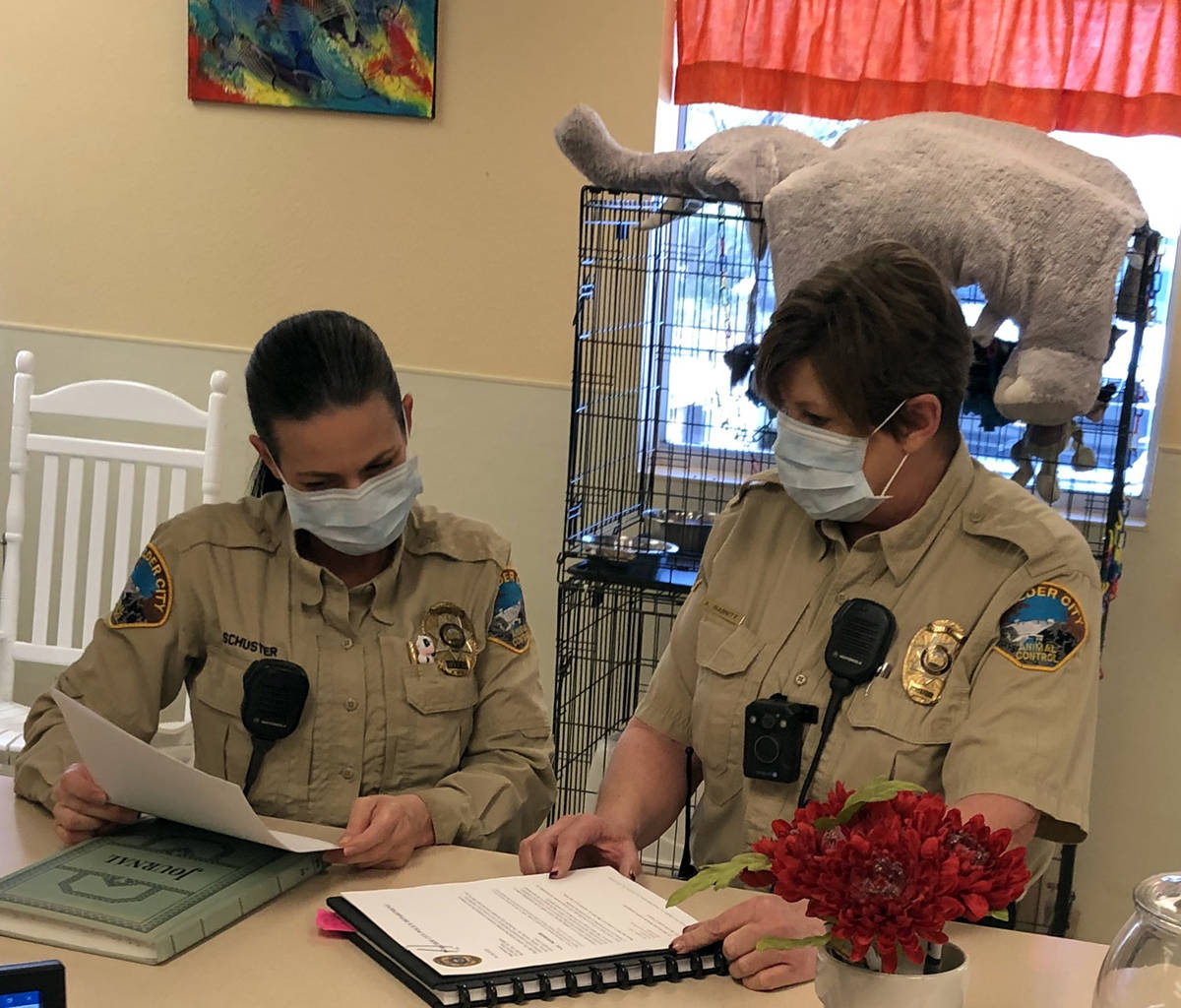 (Boulder City Animal Shelter) Boulder City Animal Control officer Rebecca Schuster, left, and A ...