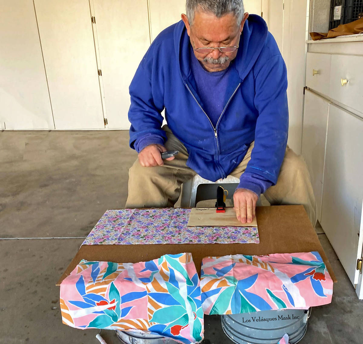 (Jesus Velasquez) Jesus Velasquez of Boulder City cuts material to be made into masks for the S ...