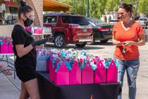(Vegas Valley Photography) Heather Marianna, left, owner of Beauty Kitchen Boutique, hands out ...