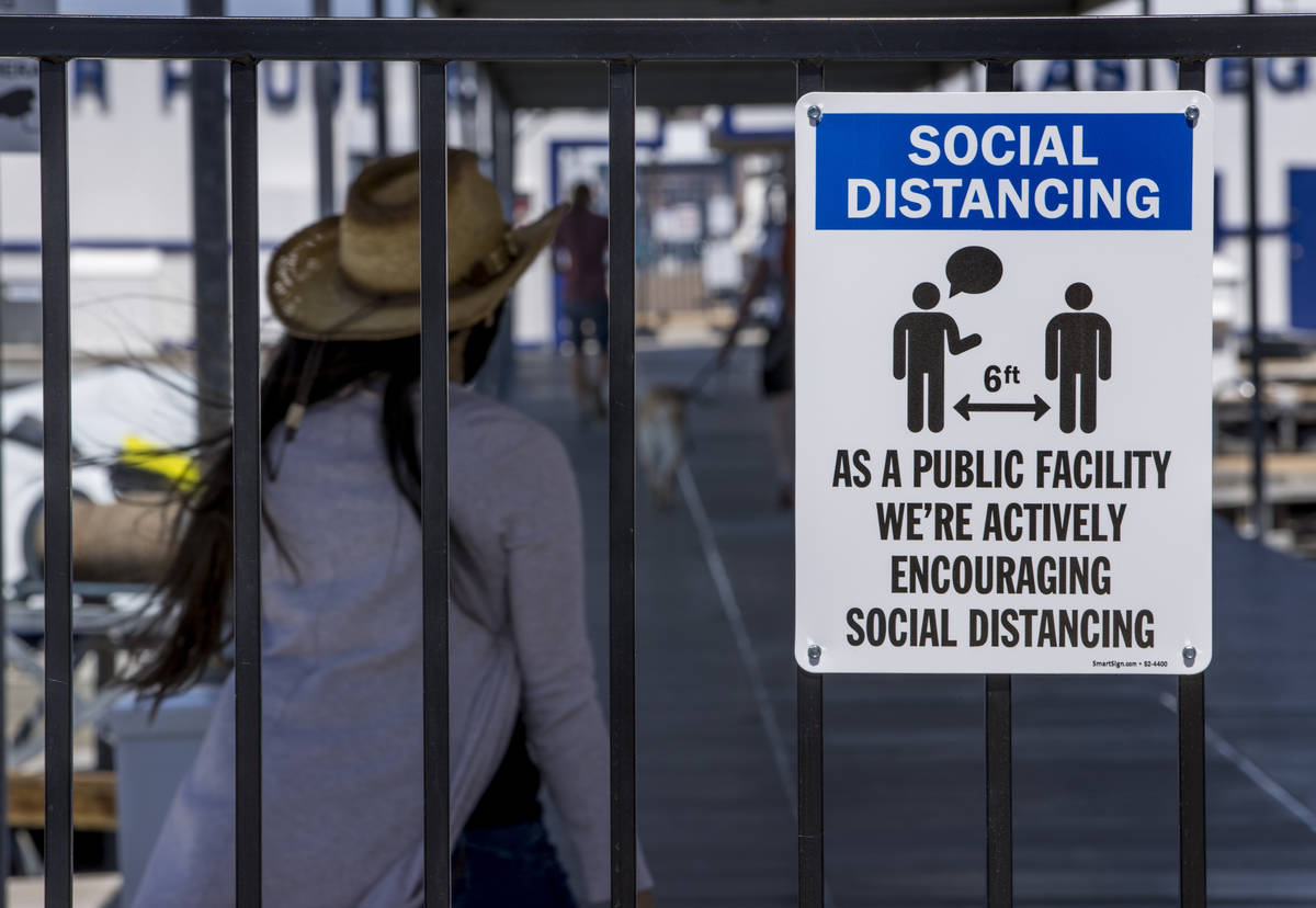 (L.E. Baskow/Las Vegas Review-Journal) A social distancing sign greets visitors at the Las Vega ...