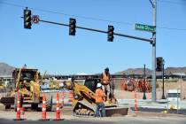 Celia Shortt Goodyear/Boulder City Review Workers with William Charles Construction repave the ...