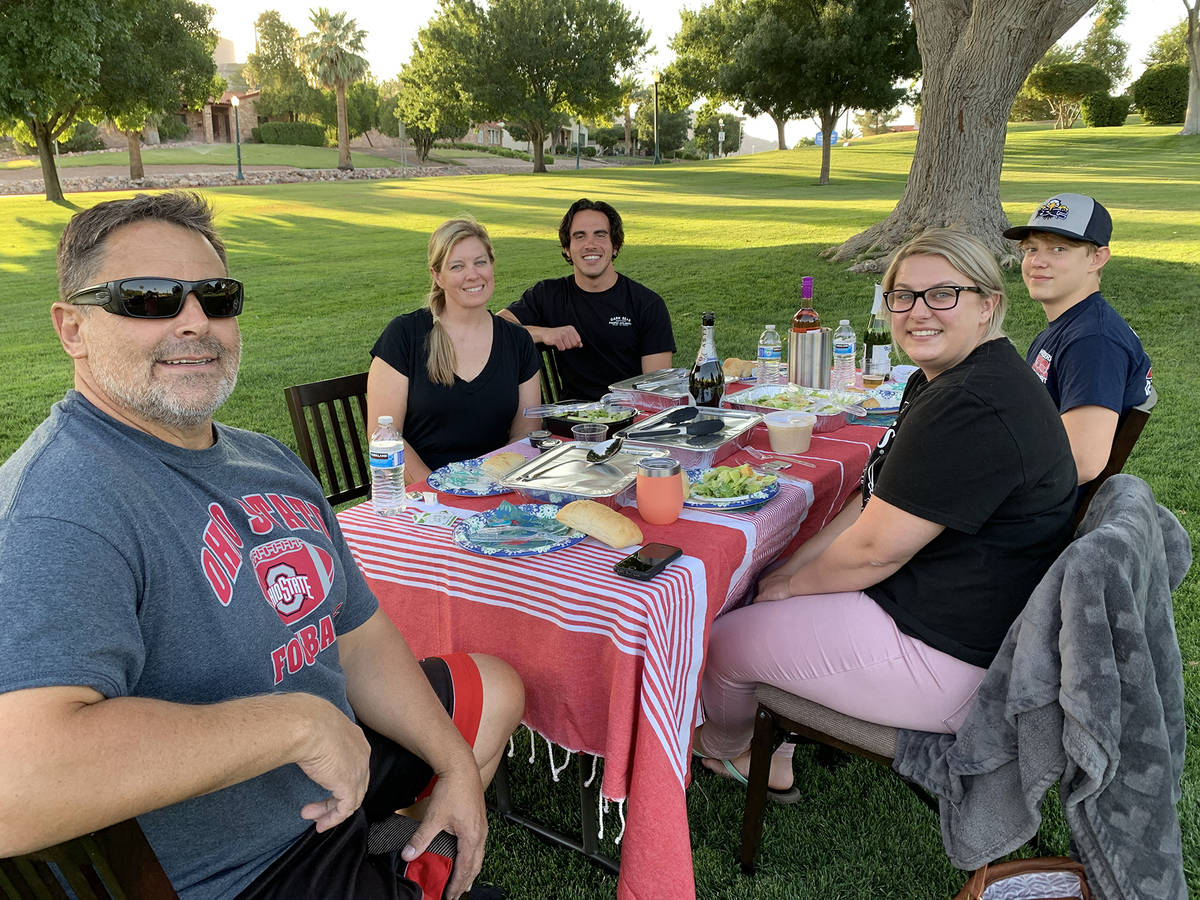 (Hali Bernstein Saylor/Boulder City Review) Enjoying an evening picnic Monday, June 29, in Wilb ...