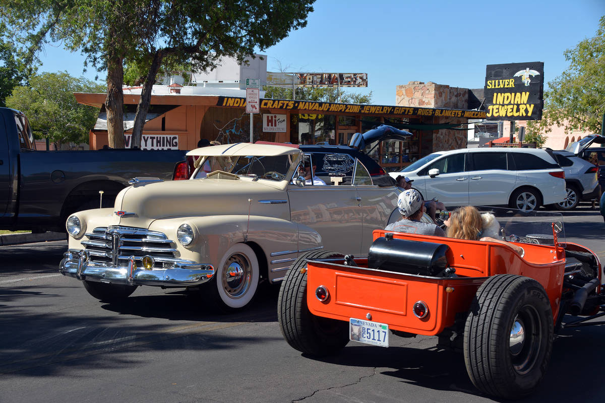 Celia Shortt Goodyear/Boulder City Review Two cars pass each other during the parade Saturday, ...