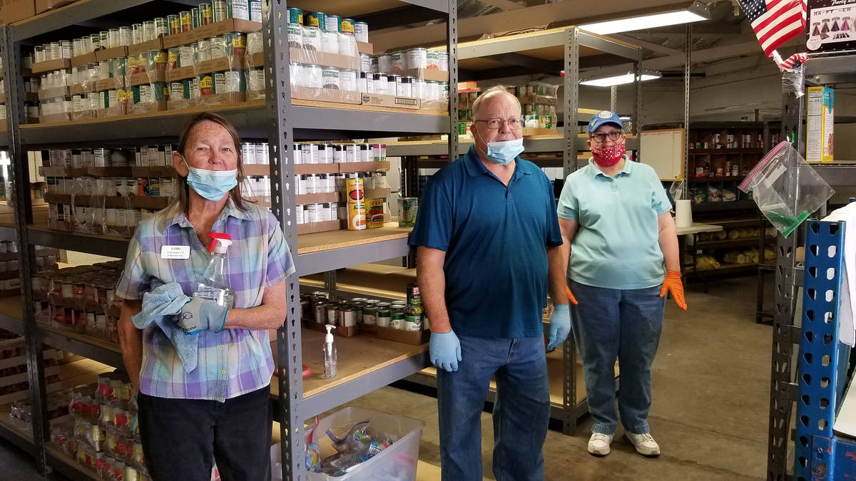 Emergency Aid of Boulder City volunteers, from left, Lori McHugh, Tom Tyler and Sue Zupanick co ...