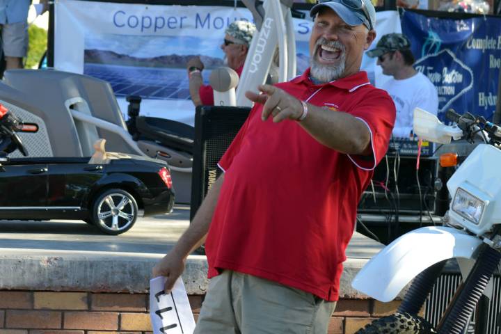 Scott Hinson spots a bid during the live auction at a past Würst Festival put on by the Boulde ...