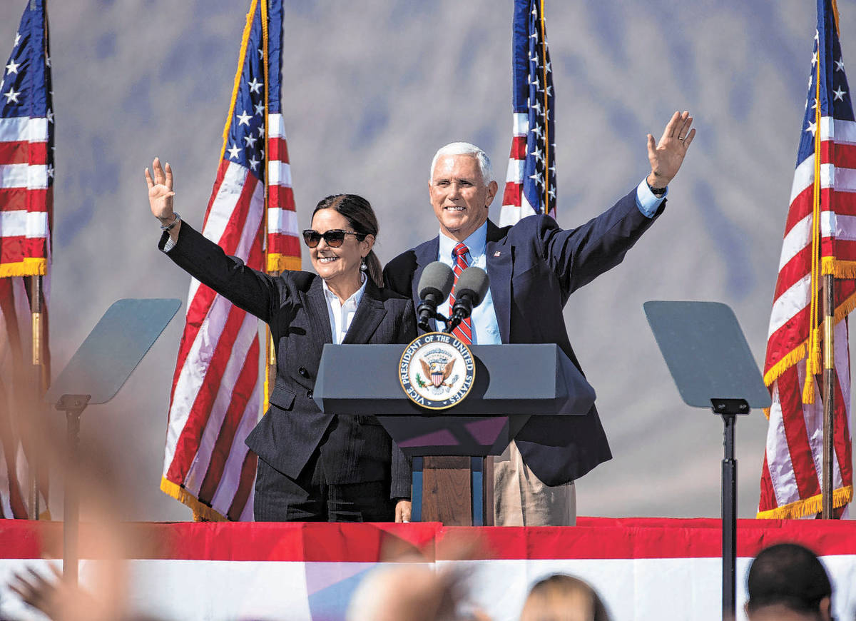 (Bizuayehu Tesfaye/Las Vegas Review-Journal) Vice President Mike Pence and his wife Karen wave ...
