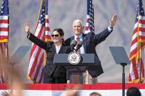 (Bizuayehu Tesfaye/Las Vegas Review-Journal) Vice President Mike Pence and his wife Karen wave ...