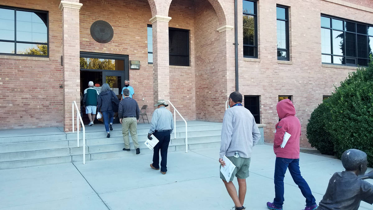 Celia Shortt Goodyear/Boulder City Review People filed into City Hall when the doors opened for ...