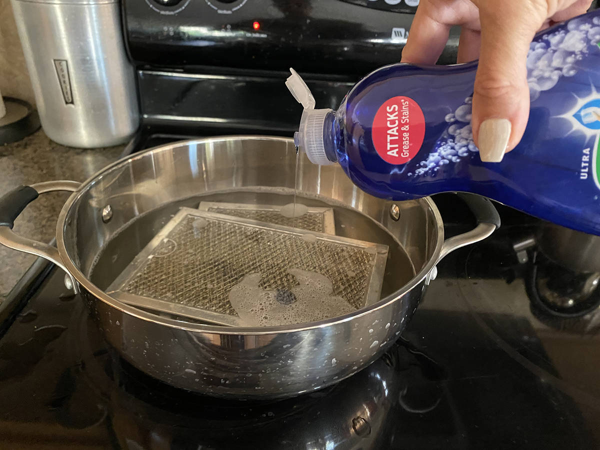(Norma Vally) Grease melts away from hood filters when they are placed in a pot of simmering wa ...