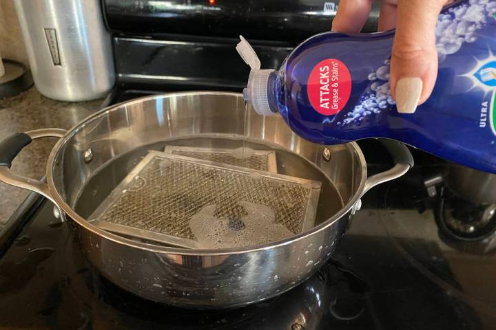 (Norma Vally) Grease melts away from hood filters when they are placed in a pot of simmering wa ...