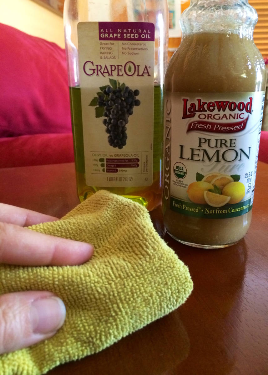 (Norma Vally) Make your own furniture polish by mixing vegetable oil and lemon juice in a spray ...