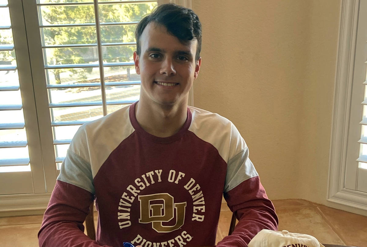 (Joan Purdy) Senior Joey Purdy signs his national letter of intent to swim for the University o ...