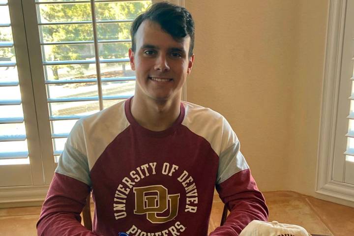 (Joan Purdy) Senior Joey Purdy signs his national letter of intent to swim for the University o ...