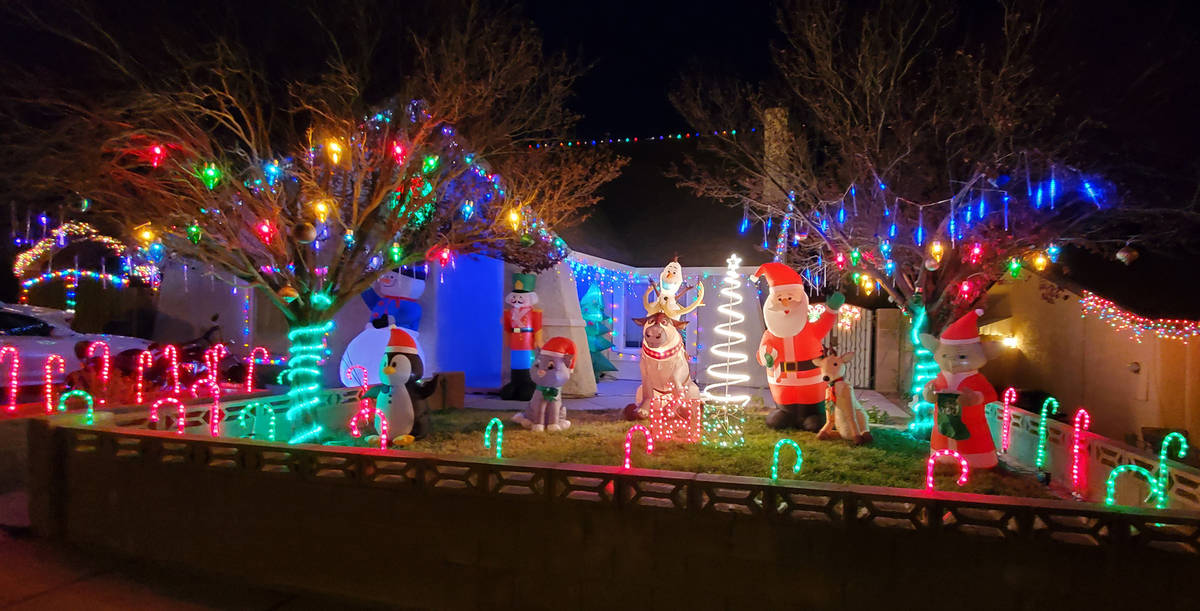 Mike Pacini Mike and Morgan Pacini's home at 653 Arrayo Way features a Christmas Yoda, Santa Cl ...