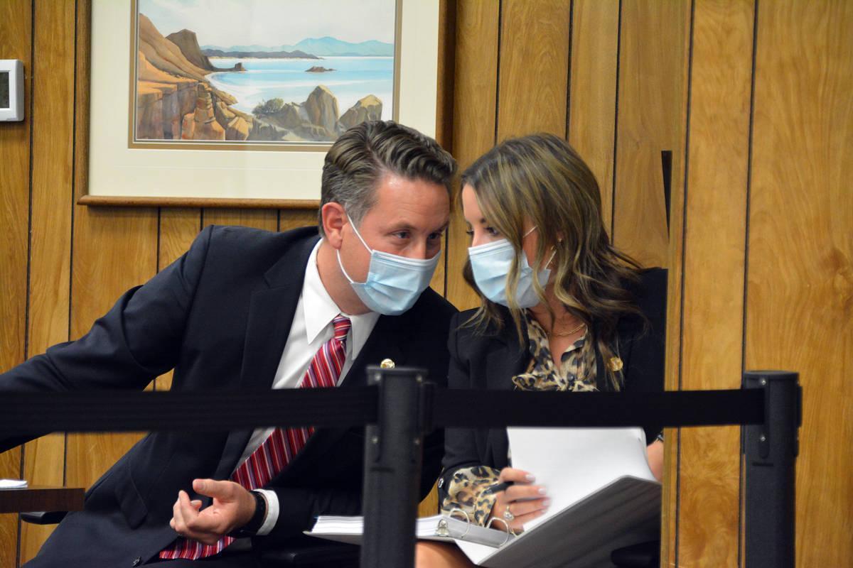 Former City Attorney Steve Morris confers with Lauren Oliver after his employment contract was ...