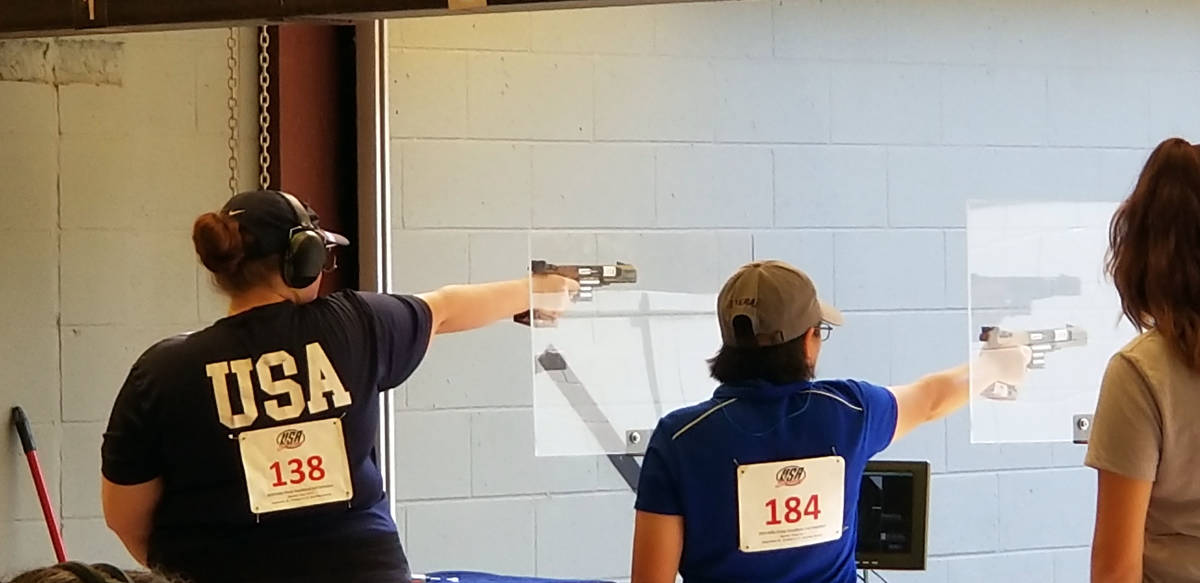 Alexis "Lexi" Lagan, left, competes in phase one of the Olympic trials for women's sport pistol ...