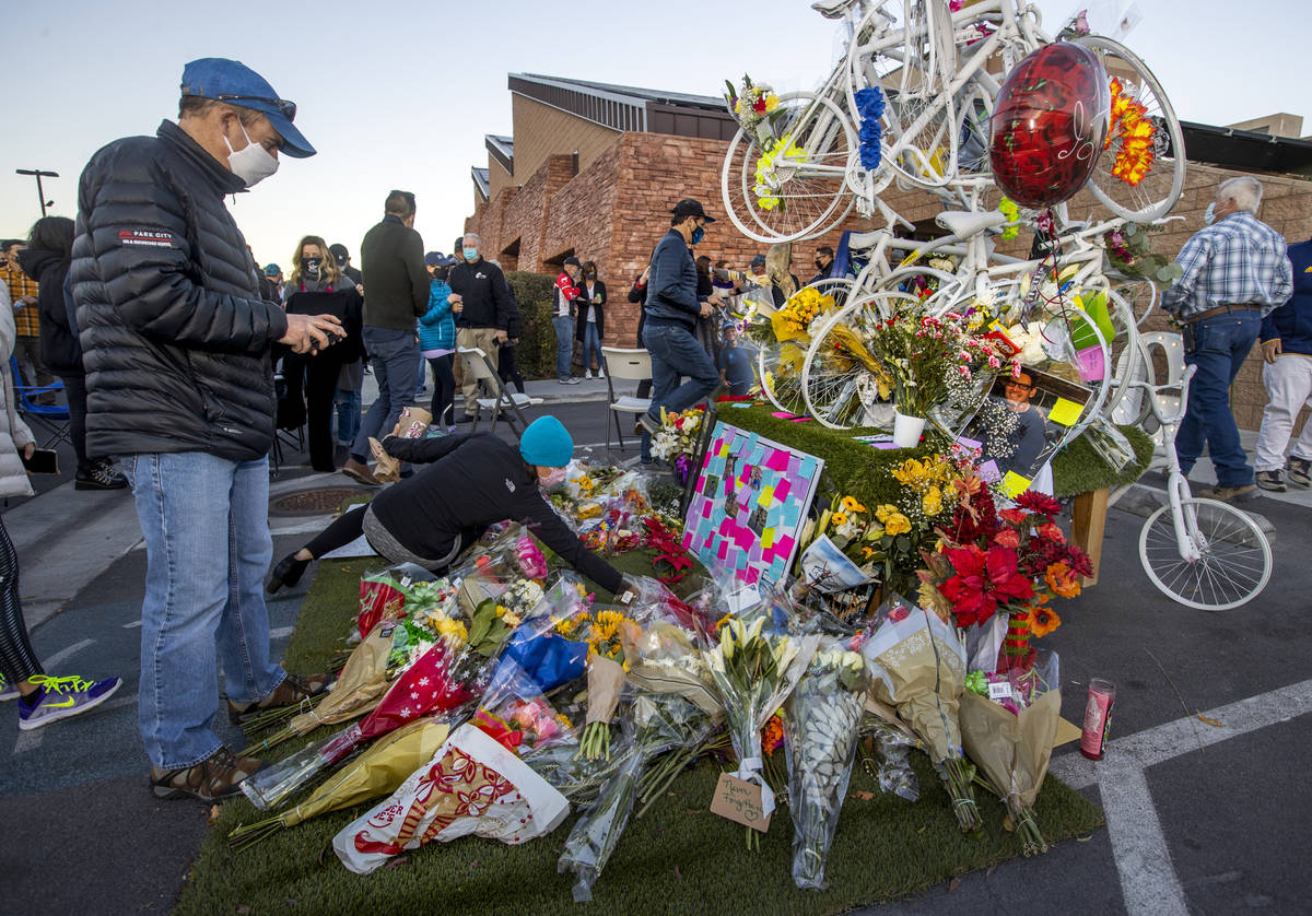 (L.E. Baskow/Las Vegas Review-Journal) Flowers are added to a memorial during a vigil honoring ...