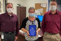 Boulder City Carol Lelles, center, was named Boulder City's employee of the year. Acting City M ...