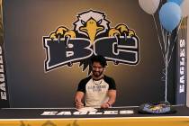(Davis family) Trey Davis, a senior at Boulder City High School, signs his letter of intent to ...