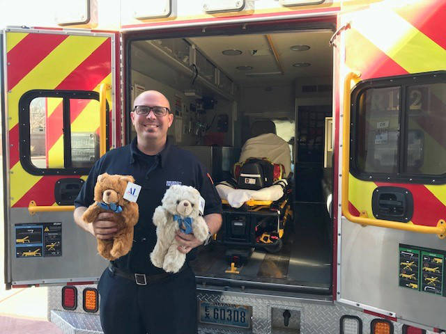 Boulder City Fire Department Boulder City firefighter Brian Shea holds teddy bears that are gi ...