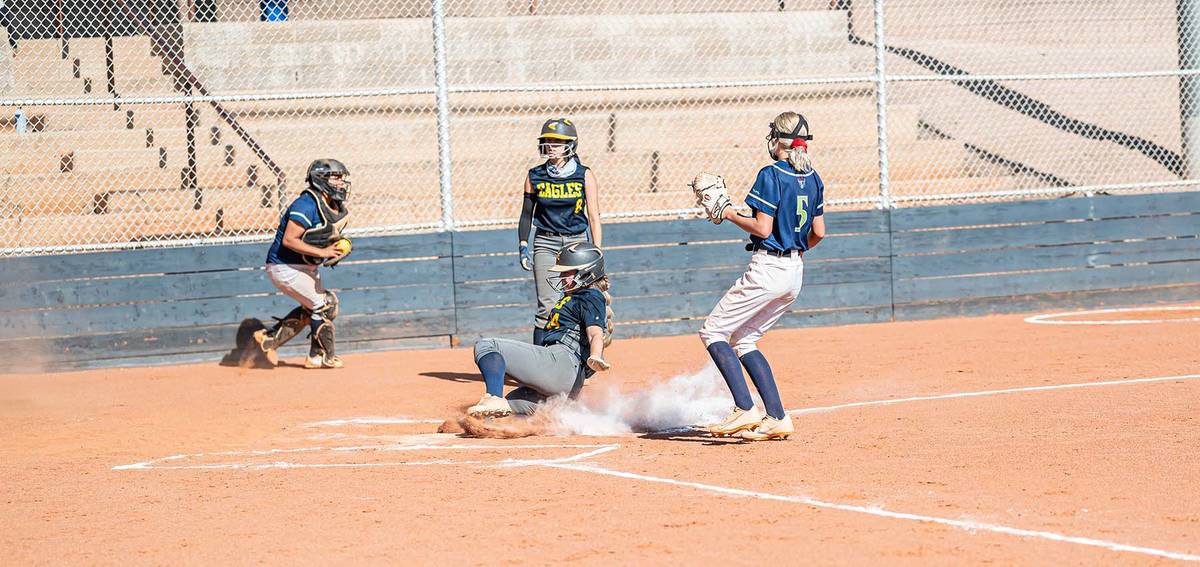 (Jamie Jane/Boulder City Review) Haley Hoover is safe as she slides into home during the Lady E ...