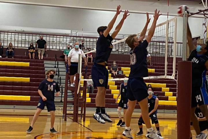 (Amy Wagner) Boulder City High School junior Kenny Rose and sophomore Tyler Lemmel go up for a ...