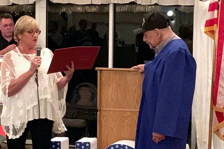 Boulder City resident Charm McElree, seen in 2019 presenting a high school diploma to 96-year-o ...