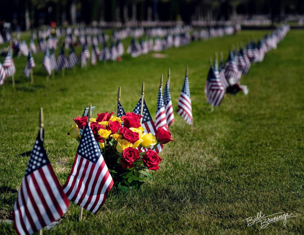 (Bill Bruninga/Special to the Boulder City Review) Flowers and flags adorn the gravesites of ve ...