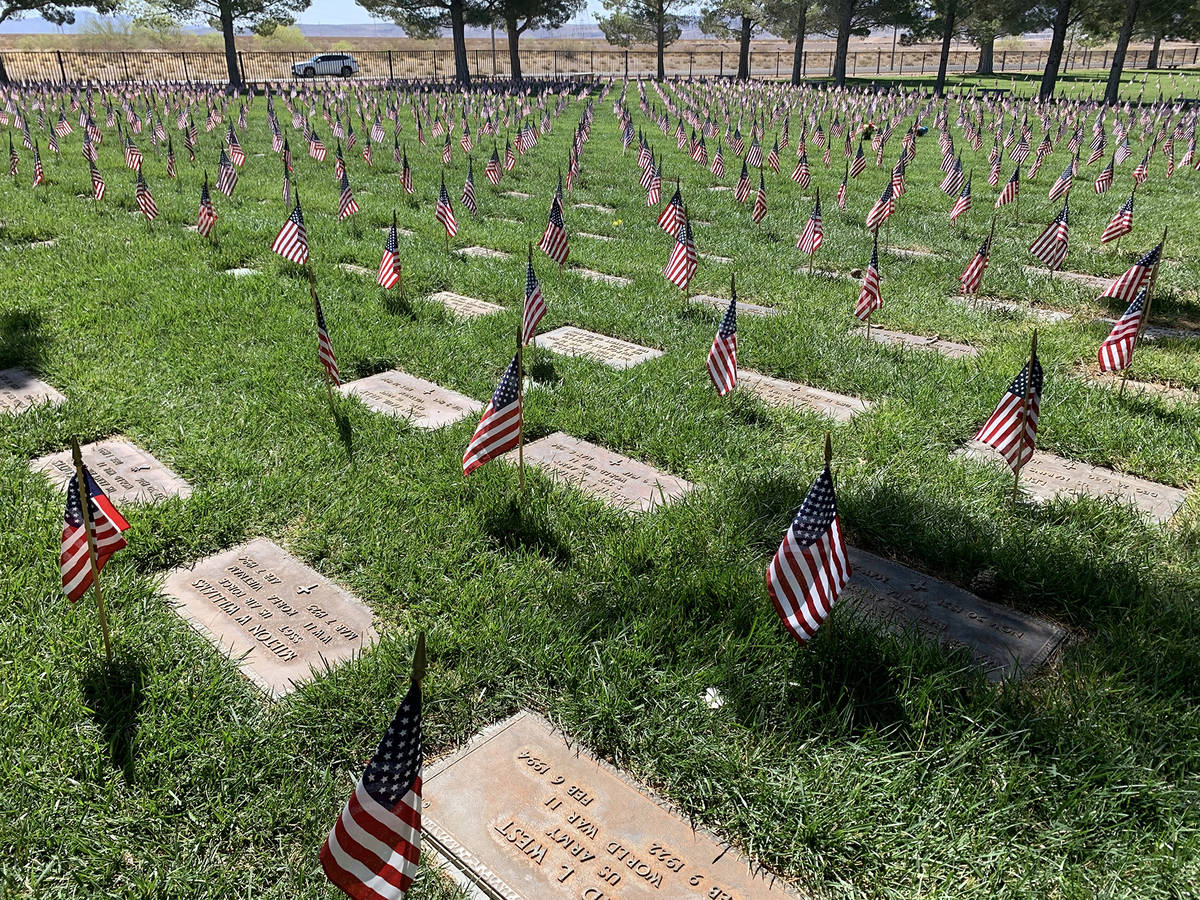 (Hali Bernstein Saylor/Boulder City Review) Flags placed at every gravesite wave in the breeze ...