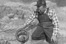 (Lake Mead National Recreation Area) Murl Emory is shown with one of the ring bolts at the Ring ...