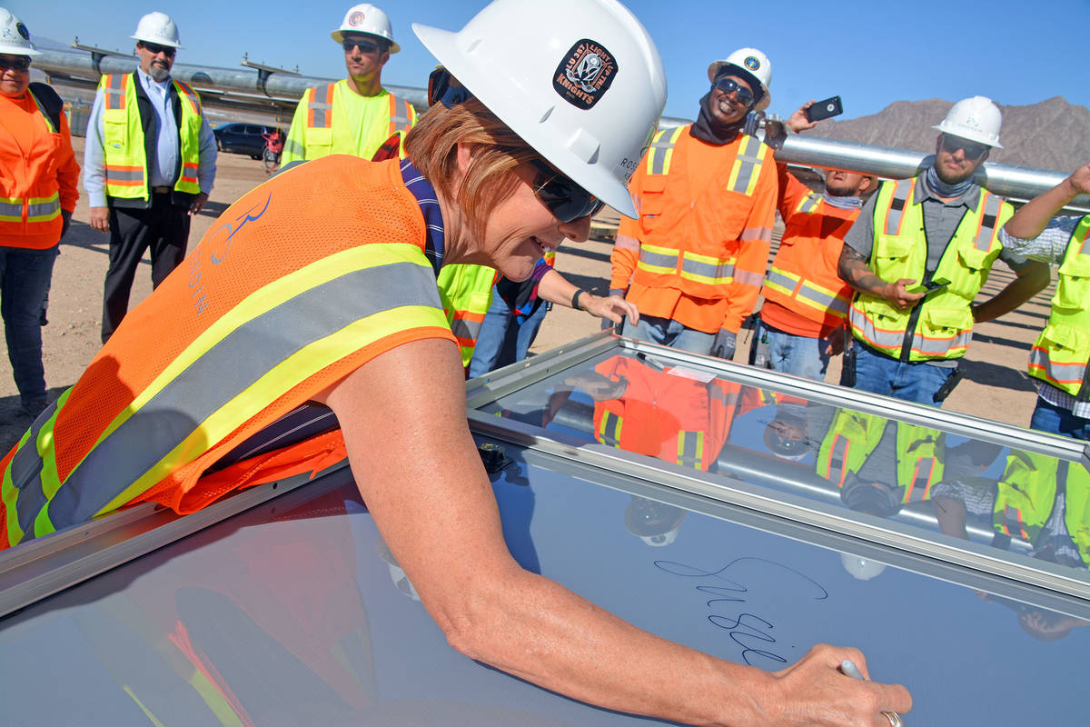 Celia Shortt Goodyear/Boulder City Review U.S. Rep. Susie Lee signs a solar panel at Townsite S ...