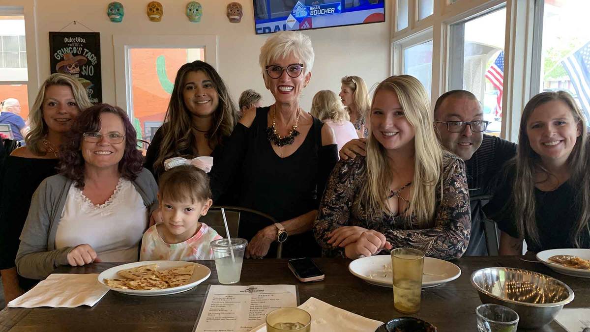 (Hali Bernstein Saylor/Boulder City Review) Cokie Booth, center, met with family and friends at ...