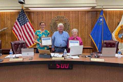 Boulder City Outgoing Councilwomen Tracy Folda, left, and Judy Hoskins, right, were recognized ...