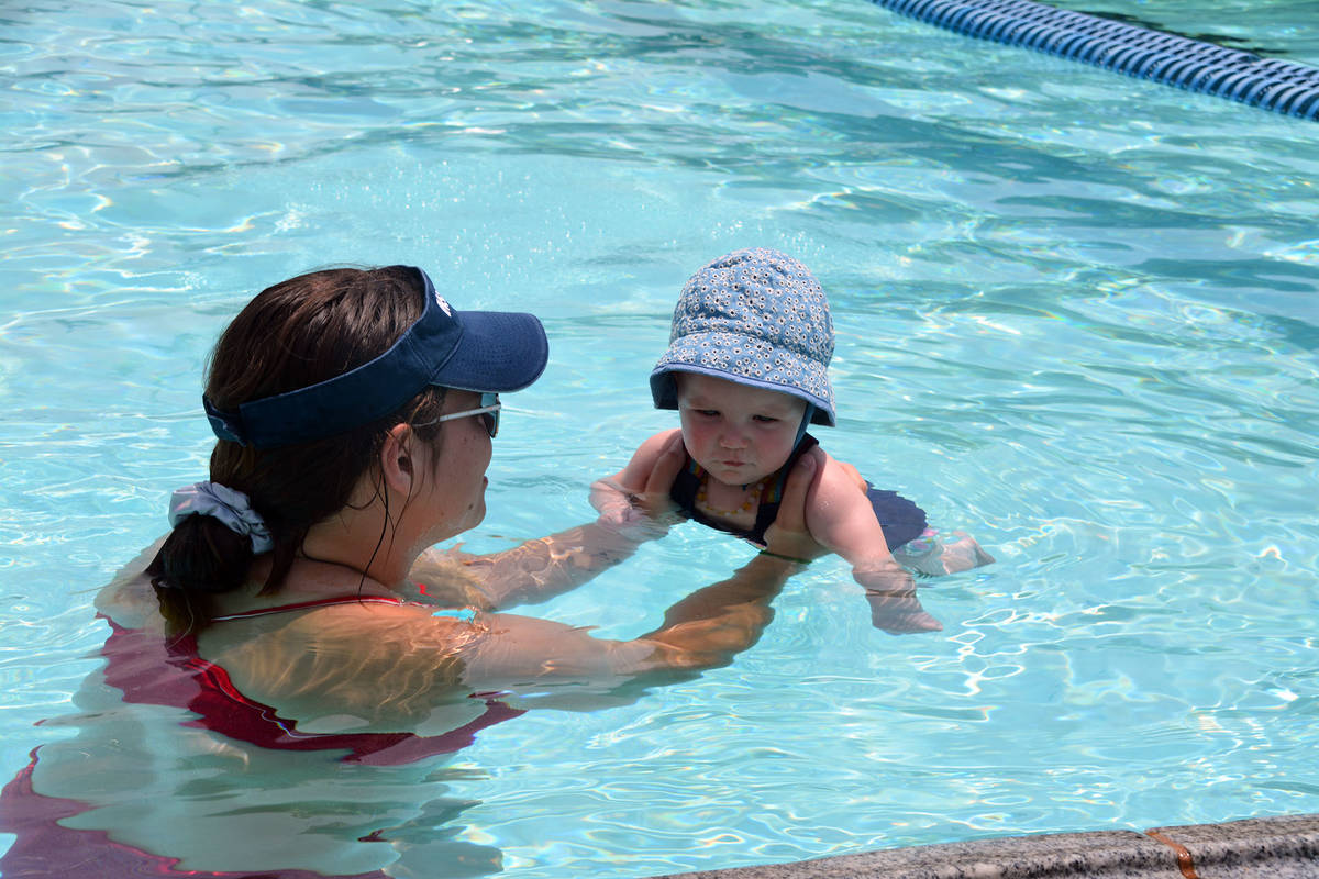 (Celia Shortt Goodyear/Boulder City Review) Swim instructor Samantha Smith works with 7-month-o ...