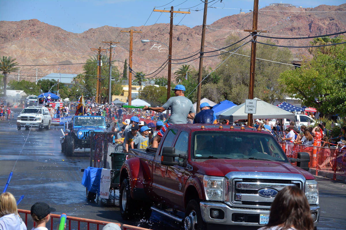 Celia Shortt Goodyear/Boulder City Review People on the water play parade entries soak the crow ...