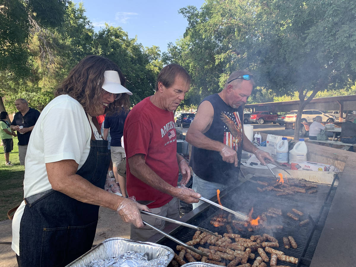 (Hali Bernstein Saylor/Boulder City Review) Cooking sausages for the Rotary Club of Boulder Cit ...
