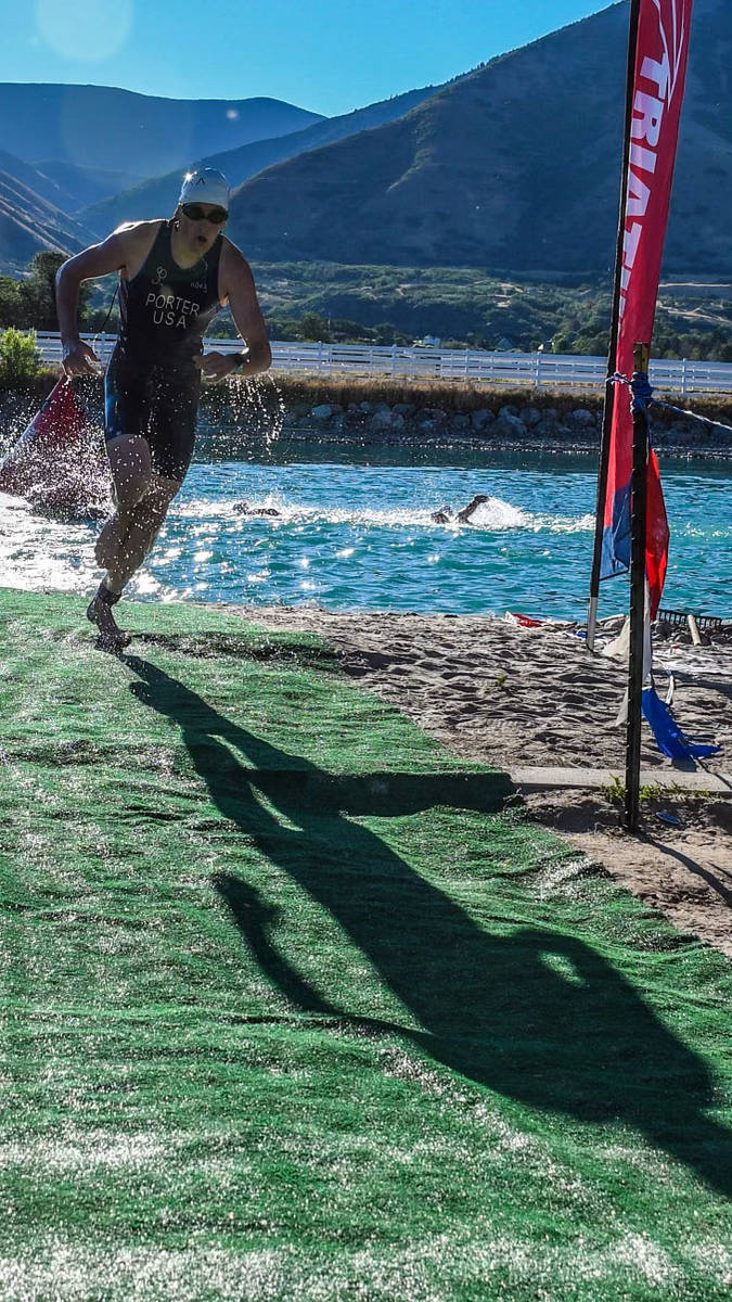 Paul Clawson Ethan Porter escapes the water to head to his next event at the Wasatch triathlon ...