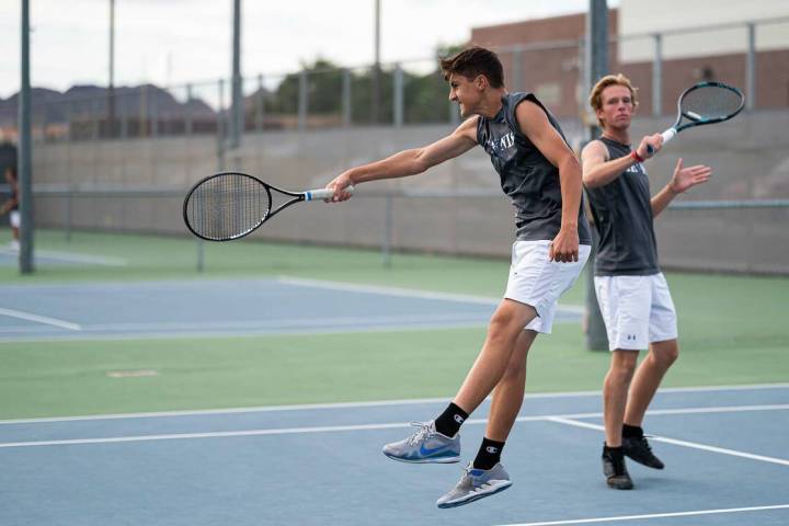 (Jamie Jane/Boulder City Review) Seniors Ben Schafler, left, and Nathan Pickett get in some pra ...