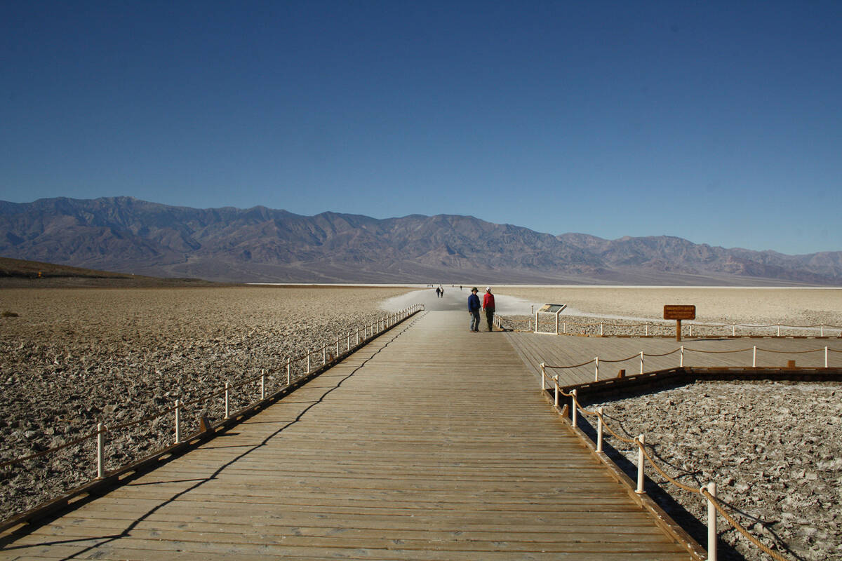 (Deborah Wall) A boardwalk leads to the salt pan at Badwater Basin at Death Valley National Par ...