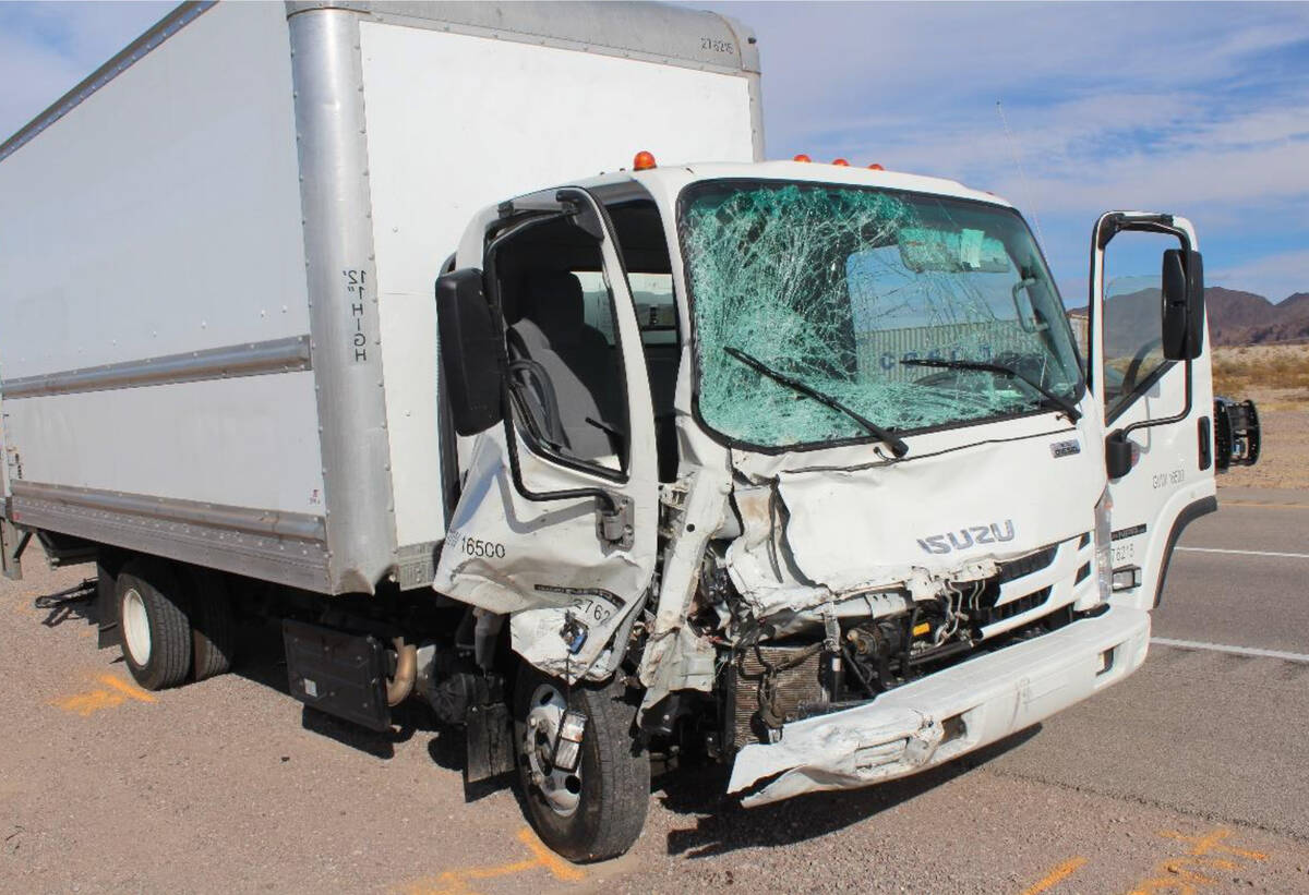 (Nevada Highway Patrol) The cab of a box truck was severly damaged after crashing into several ...