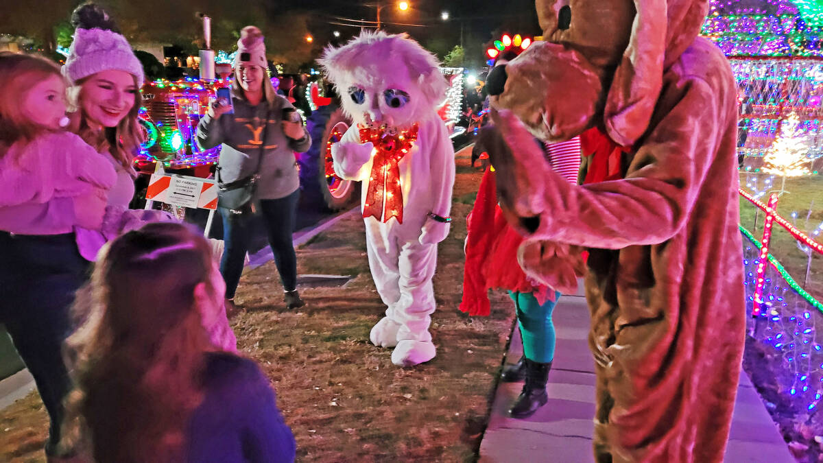 Celia Shortt Goodyear/Boulder City Review Jingle Cat and Hoover help turn on the lights at The ...