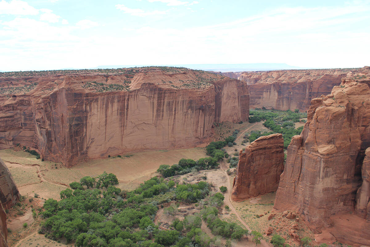 (Deborah Wall) The steep red sandstone cliffs at Canyon de Chelly National Monument near Chinle ...