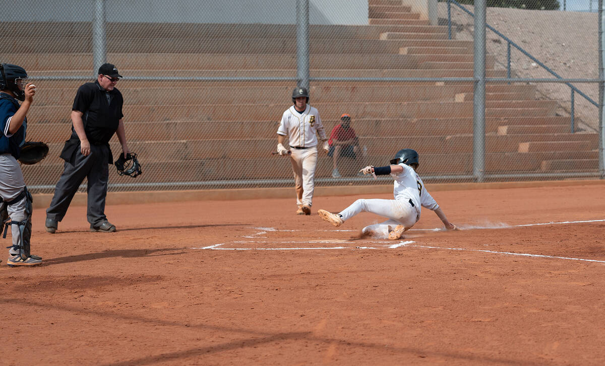 (Jamie Jane/Boulder City Review) Zanen Shupp slides into home plate during the Eagles’ 6 ...