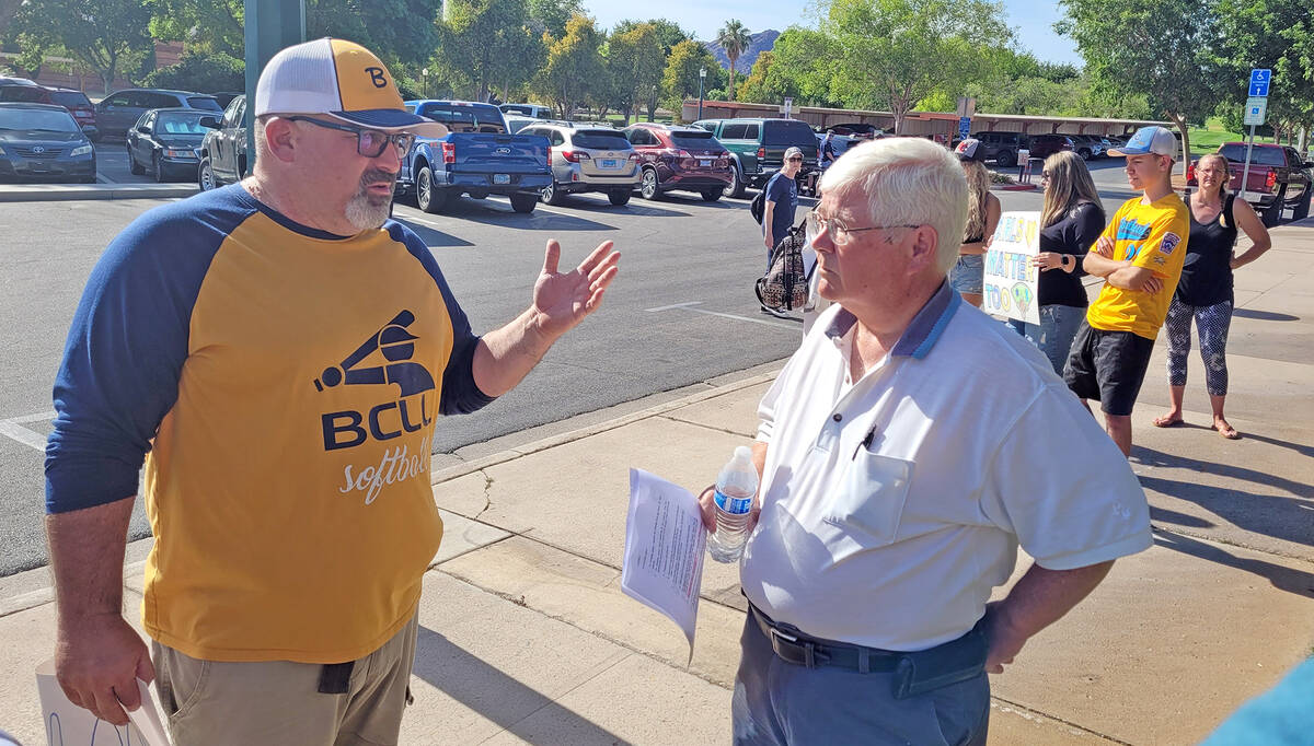 (Celia Shortt Goodyear/Boulder City Review) Softball coach Michael Keeton, left, talks with May ...
