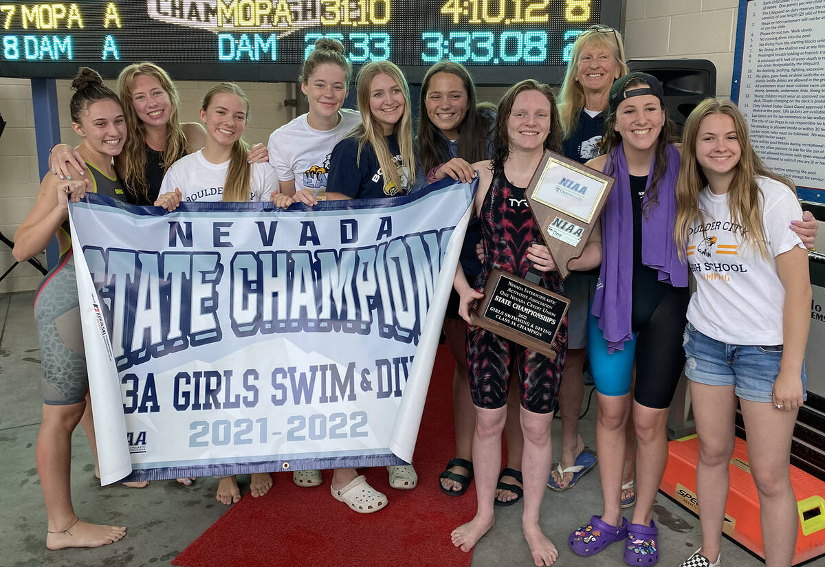 (Sara Carroll) Members of Boulder City High School’s girls swim team celebrate their eighth c ...