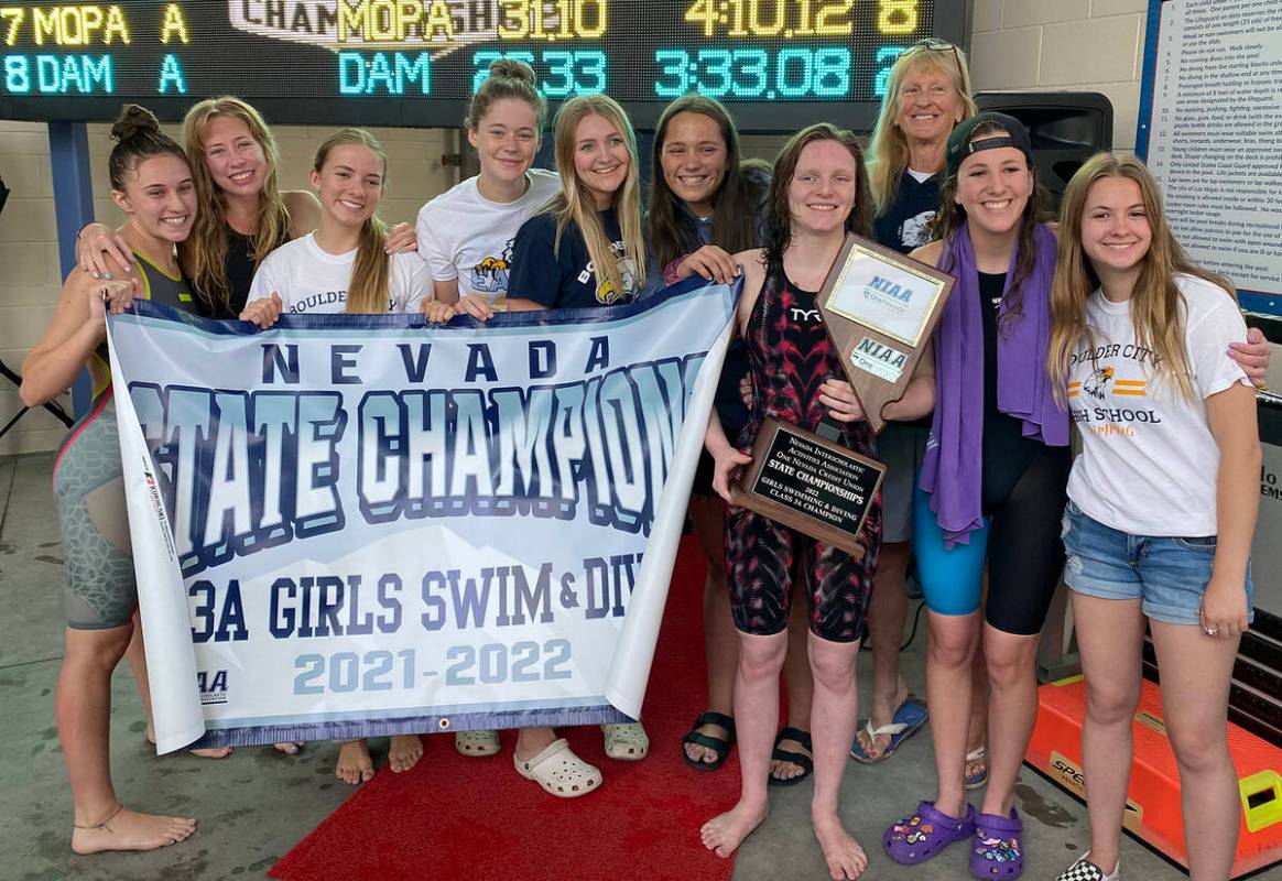 (Sara Carroll) Members of Boulder City High School’s girls swim team celebrate their eighth c ...